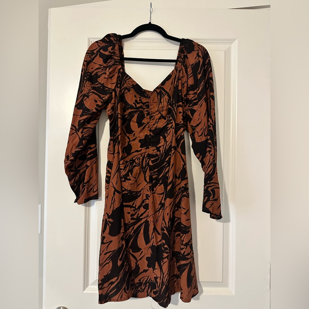 Brown mini dress with black flower design.